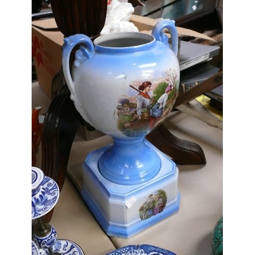 105 - Victorian Staffordshire two handled vase on square stand, in pale blue with panels decorated with sh... 