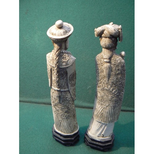 195A - A pair of Chinese resin figures of an Emperor and Empress, simulating ivory, 26cm H.