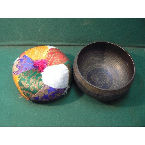 5 - A good 20th Century graduated set of Tibetan patinated brass singing bowls with cushions and mallets... 