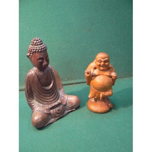 225 - A carved wooden figure of the seated buddha (20cm) and a carved wood laughing Buddha (16cm).