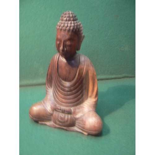 225 - A carved wooden figure of the seated buddha (20cm) and a carved wood laughing Buddha (16cm).