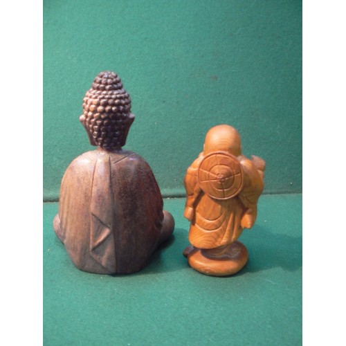 225 - A carved wooden figure of the seated buddha (20cm) and a carved wood laughing Buddha (16cm).