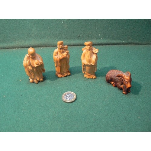 223 - Three carved wooden miniature figures of Chinese immortals and a Japanese netsuke of a mountain goat... 