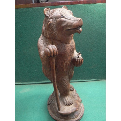 86 - A late 19th Century carved wood Black Forest bear tobacco jar holder. Stands 45cm h. Originally woul... 