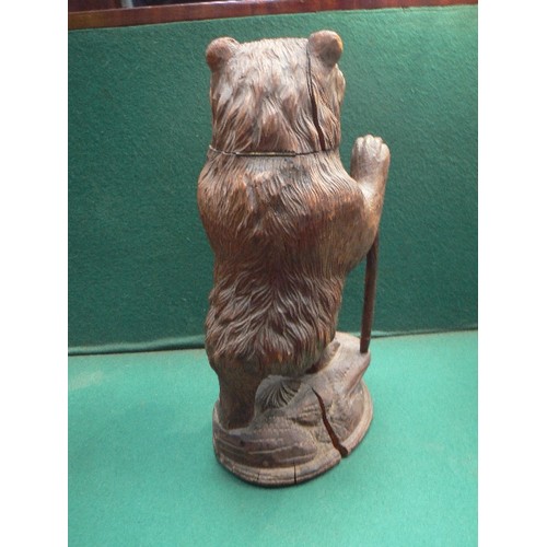 86 - A late 19th Century carved wood Black Forest bear tobacco jar holder. Stands 45cm h. Originally woul... 