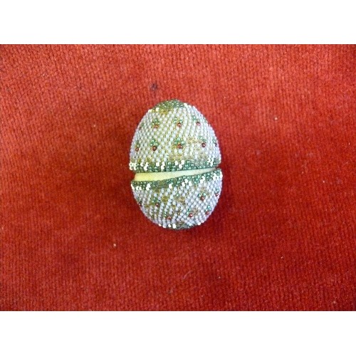 60 - A mid victorian beadwork covered carved bone egg containing a set of miniature bone dominoes