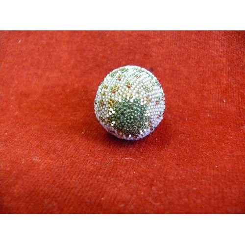 60 - A mid victorian beadwork covered carved bone egg containing a set of miniature bone dominoes