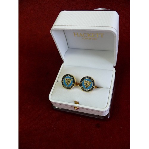 36 - Pair of cufflinks with enamelled fronts marked 