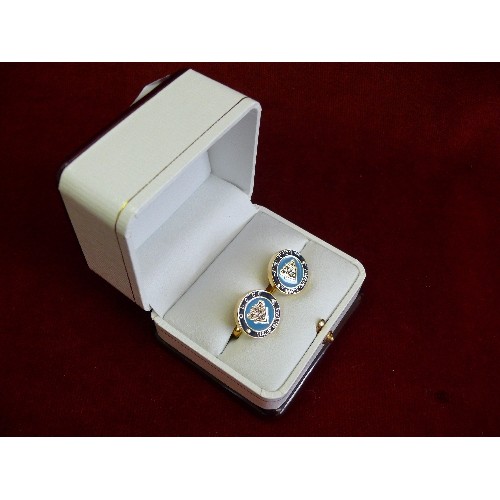 36 - Pair of cufflinks with enamelled fronts marked 