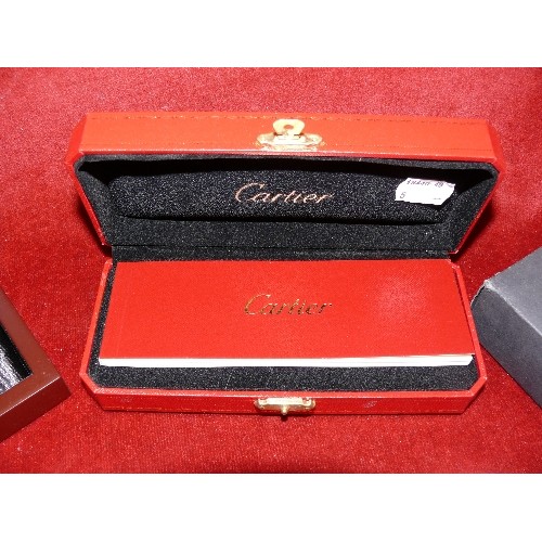 21 - Two luxury brand boxes;  Cartier pen box with booklet in red and gilt with outer box and Audemars Pi... 