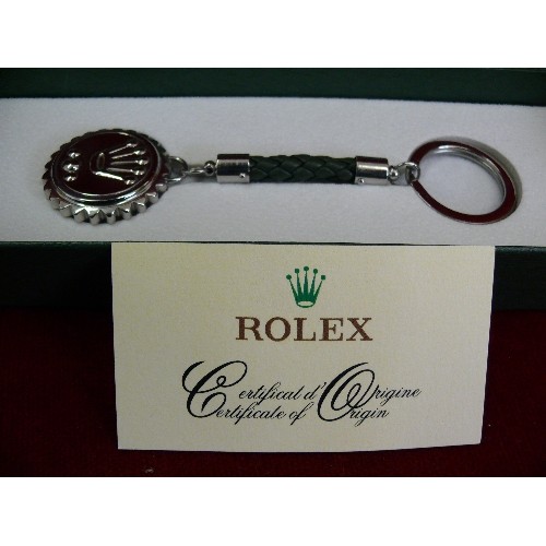 23 - Rolex key ring with certificate in original Rolex box, with outer box, no markings on the back.