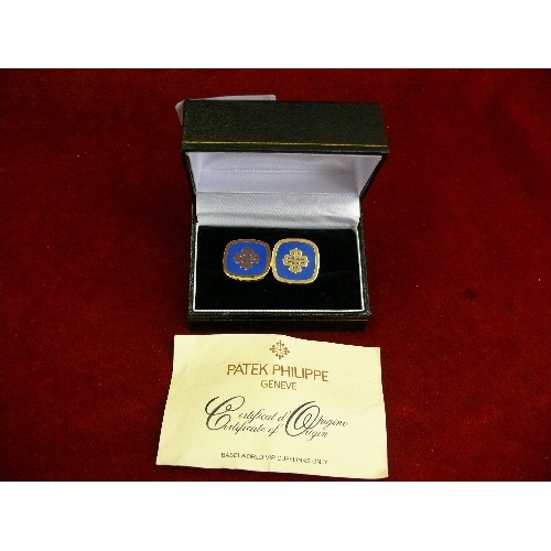 24 - Pair of Patek Philippe Switzerland cufflinks in blue enamel and gilt, with certificate and box