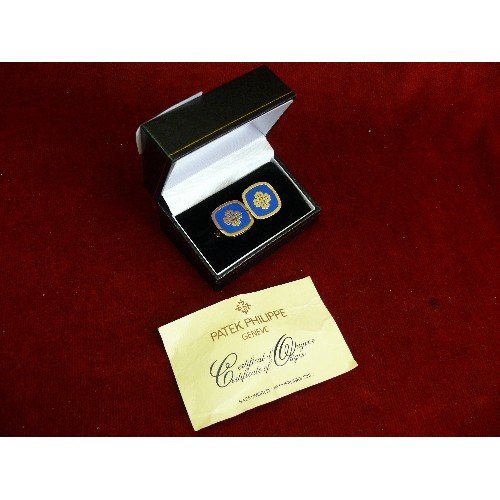 24 - Pair of Patek Philippe Switzerland cufflinks in blue enamel and gilt, with certificate and box