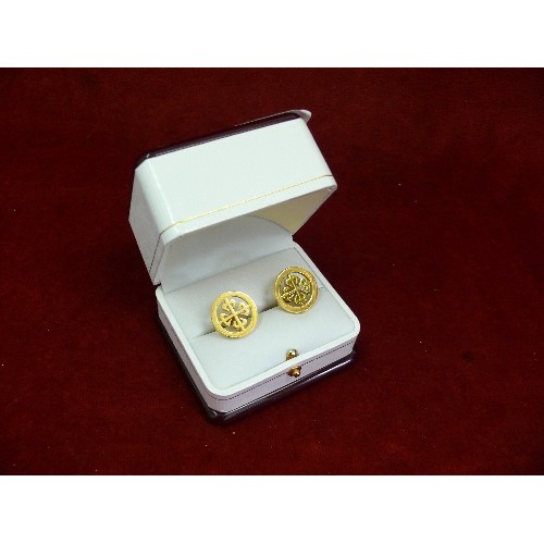 35 - A pair of Patek Philippe cufflinks with their calatrava cross logo, engraved 