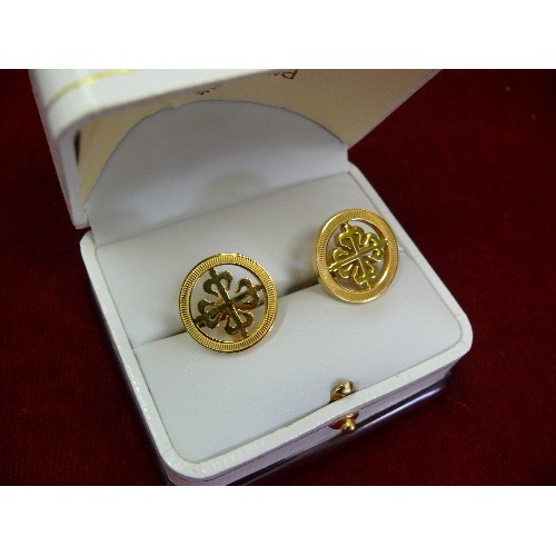 35 - A pair of Patek Philippe cufflinks with their calatrava cross logo, engraved 