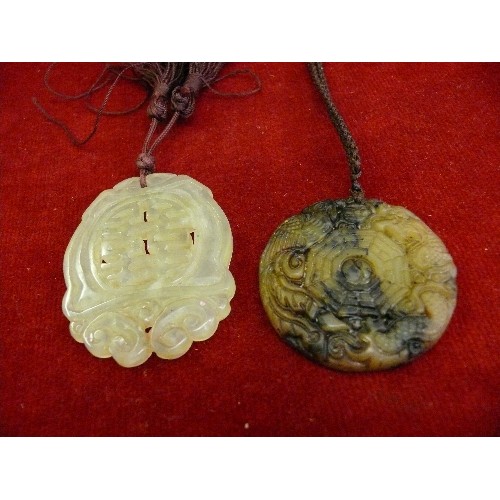 67 - Two vintage Chinese jade disc pendants, one in pale green jade with Chinese calligraphy, the other i... 