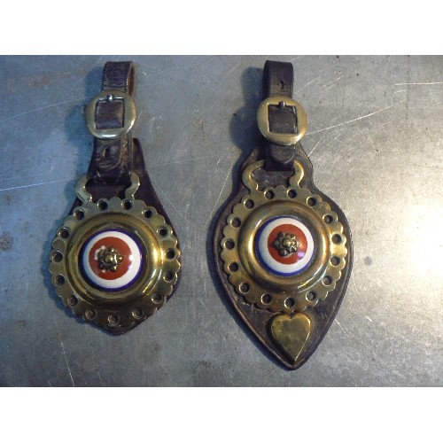 352 - Two antique face pieces with pot centred horse brasses in red white & blue.