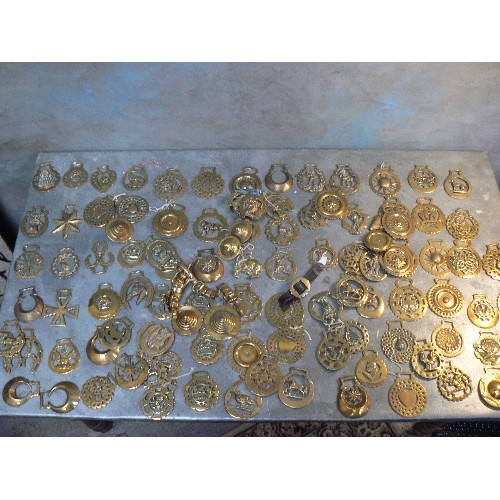 369 - Crate of over 100 antique and 20th Century horse brasses, both cast & stamped. All types.