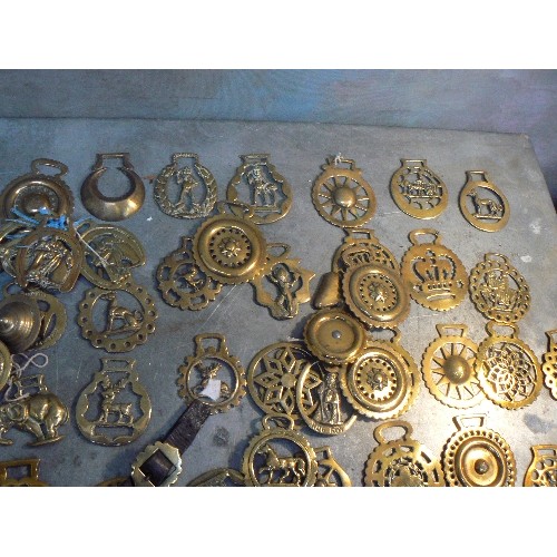 369 - Crate of over 100 antique and 20th Century horse brasses, both cast & stamped. All types.