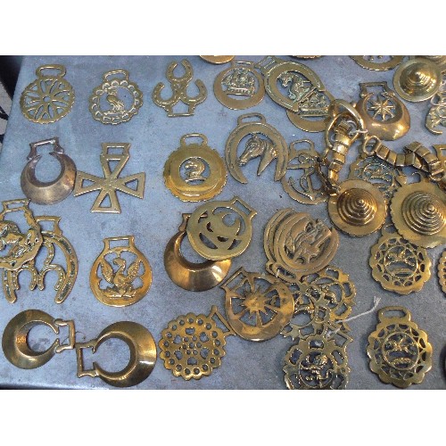 369 - Crate of over 100 antique and 20th Century horse brasses, both cast & stamped. All types.