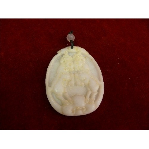 69 - Four 20th Century Chinese carved pendants including a jade buddha, a jade disc with brass dragon det... 