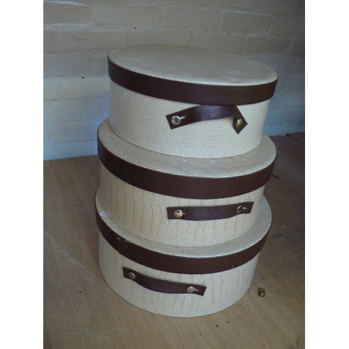 339 - A graduated set of 3 hat boxes in fawn 