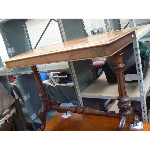 405 - A mid Victorian mahogany side table with turned stretcher on original white pot castors