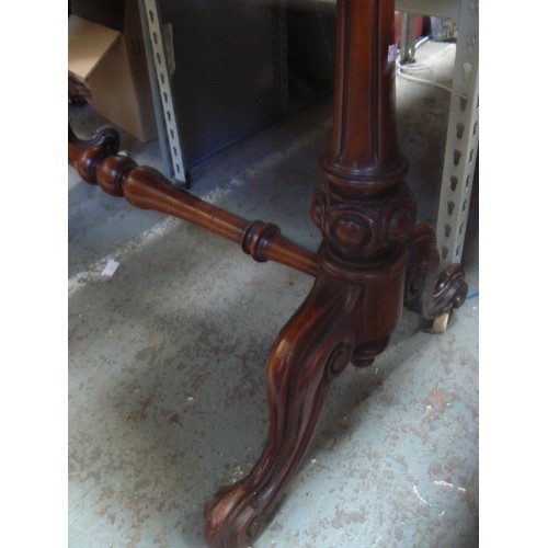 406 - A mid Victorian mahogany side table with turned stretcher on original white pot castors (1 wheel mis... 