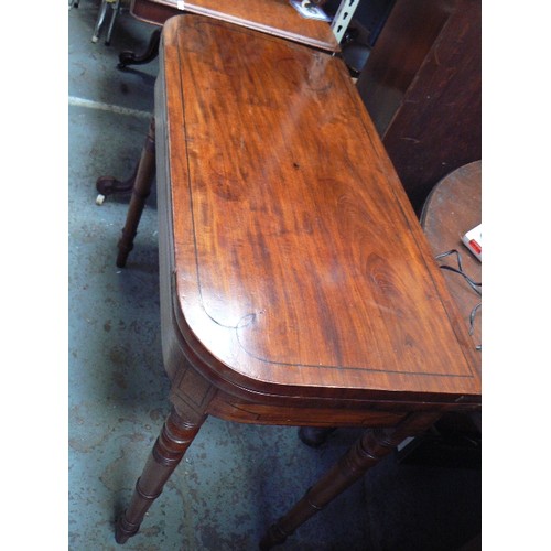 410 - A Regency mahogany card table with ebony inlay, baize lined, on turned legs - loss to veneer on fron... 