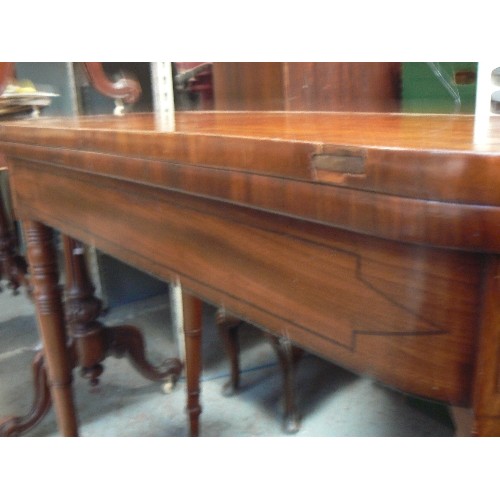 410 - A Regency mahogany card table with ebony inlay, baize lined, on turned legs - loss to veneer on fron... 