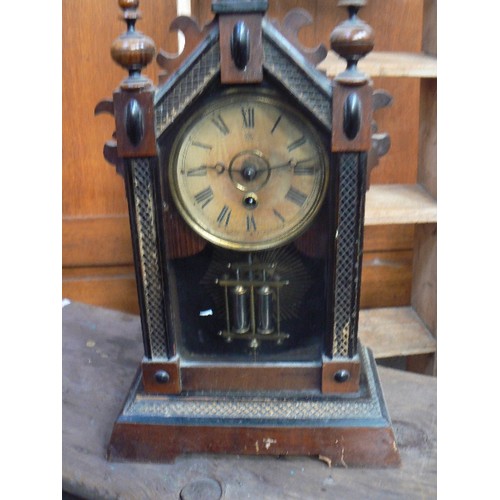 415 - A 19th Century Junghens mantle clock with mercury type pendulum, in a Victorian gothic style case