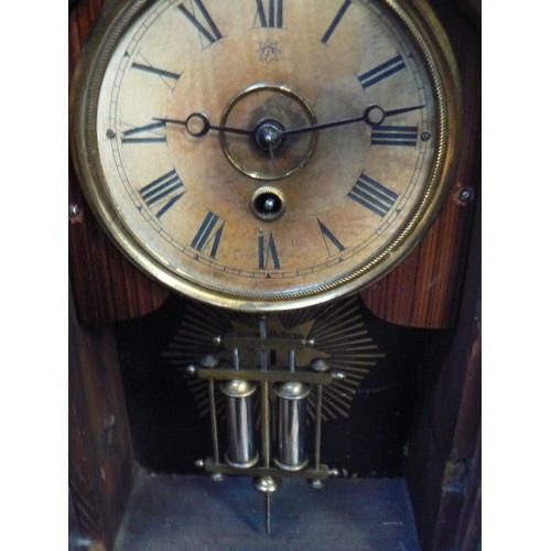 415 - A 19th Century Junghens mantle clock with mercury type pendulum, in a Victorian gothic style case