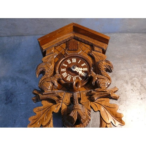 418B - Vintage Black Forest cuckoo wall clock. The movement by Herbert Herr Triberg, Germany. The case carv... 