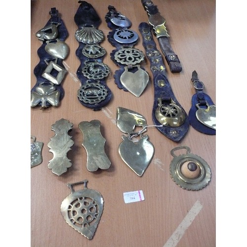 384 - Good selection of some unusual antique brasses, on straps and singles. Includes large stamped shell,... 