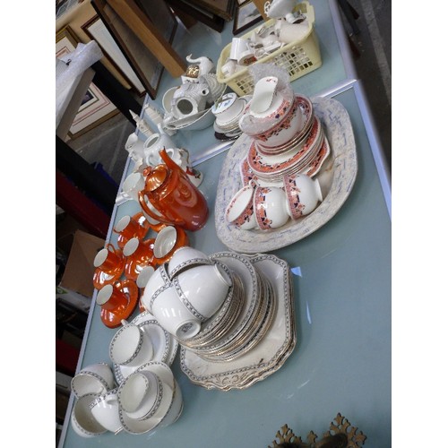 143 - Large lot of mixed vintage china including crested china, Art Deco orange lustre coffee set, Duchess... 