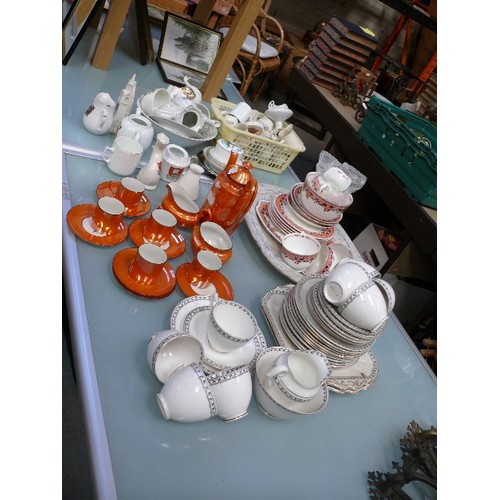 143 - Large lot of mixed vintage china including crested china, Art Deco orange lustre coffee set, Duchess... 