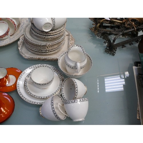 143 - Large lot of mixed vintage china including crested china, Art Deco orange lustre coffee set, Duchess... 