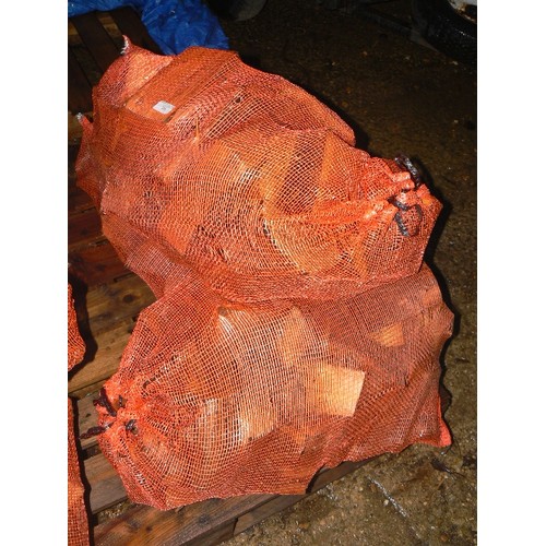 553 - THREE SACKS OF SEASONED LOGS.