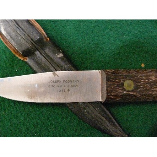 50 - A BRITISH MILITARY SERVICE KNIFE IN SCABBARD.