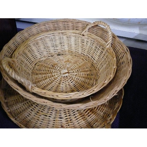 104 - FOUR WICKER BASKETS OF VARIOUS SIZES.