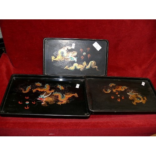 109 - THREE HANDPAINTED ORIENTAL TRAYS.