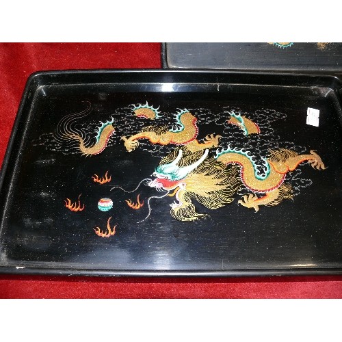 109 - THREE HANDPAINTED ORIENTAL TRAYS.