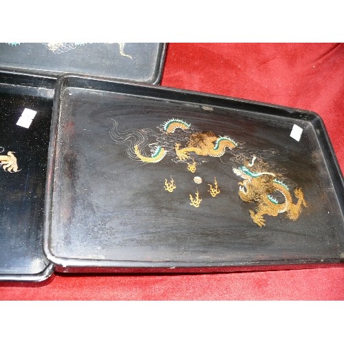 109 - THREE HANDPAINTED ORIENTAL TRAYS.