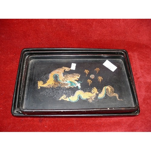 109 - THREE HANDPAINTED ORIENTAL TRAYS.