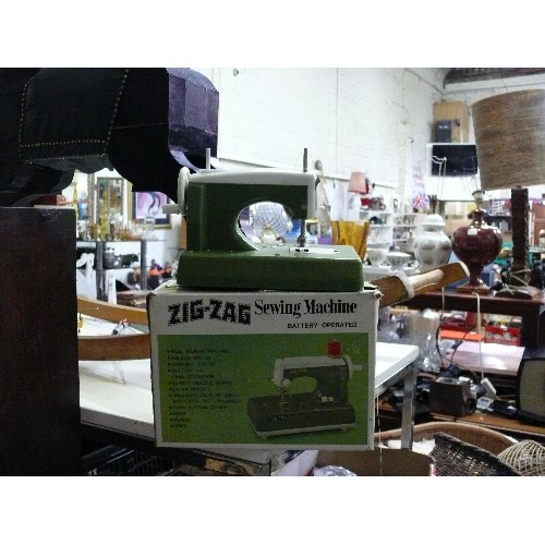 214 - ZIG-ZAG SEWING MACHINE, BATTERY OPERATED, WITH ORIGINAL BOX.