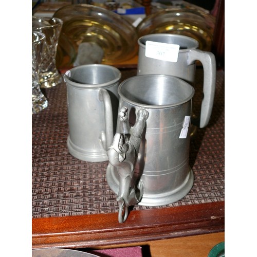 307 - THREE PEWTER TANKARDS