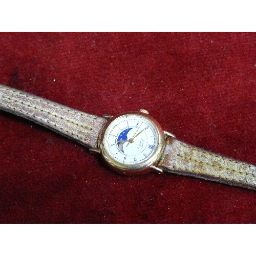 26 - A LADIES ACCURIST WATCH WITH DATE MOON AND STARS.