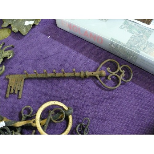 112 - CAST IRON KEY SHAPED HOOKS, A HAND AND VARIOUS HORSE BITS.