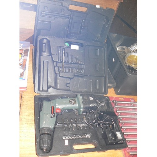 392 - CASED 12V DRILL WITH BATTERY AND CHARGER PLUS A FUTHER CASE WITH AN HITACHI DRILL AND A TORCH.