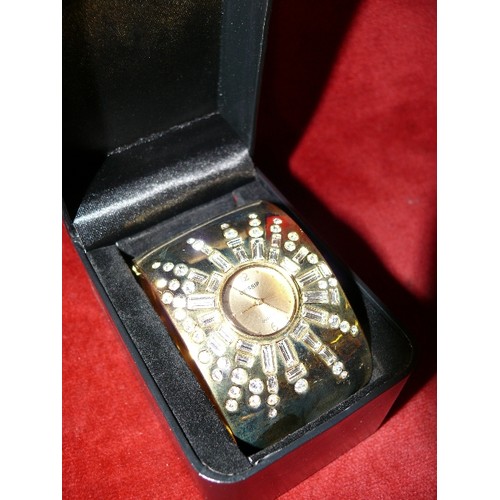 7B - BOXED GOSSIP QUARTZ VERY BLINGY GOLD METAL AND DIAMANTE LADIES WATCH.